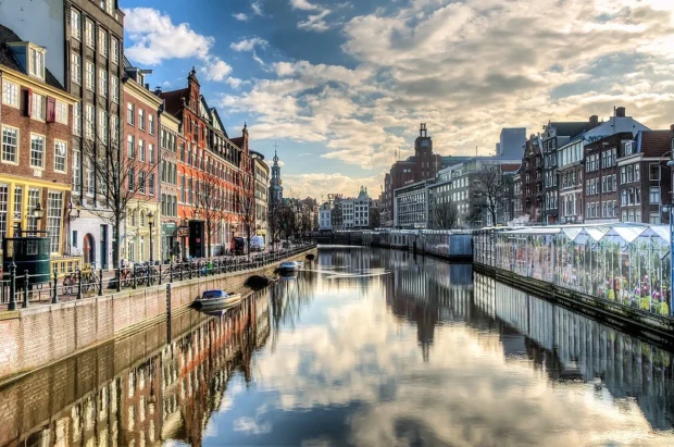 Navigate the Charm of Amsterdam’s Canal Ring by Water and Foot