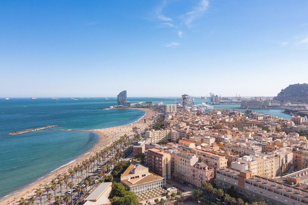 Aerial view of Barceloneta Beach and Port Vell in Barcelona, Spain (51226238126)
