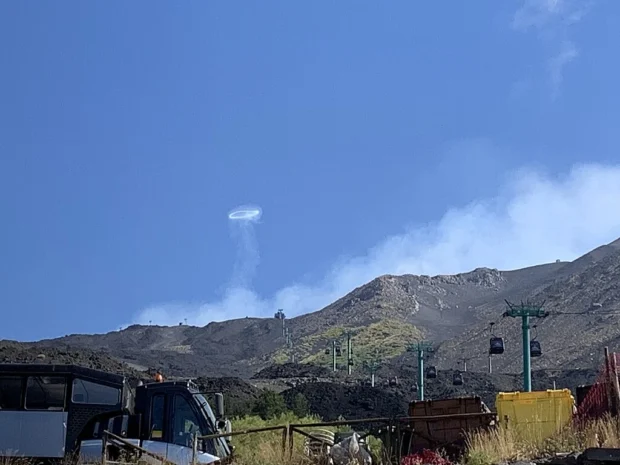 Smoke ring above Mount Etna