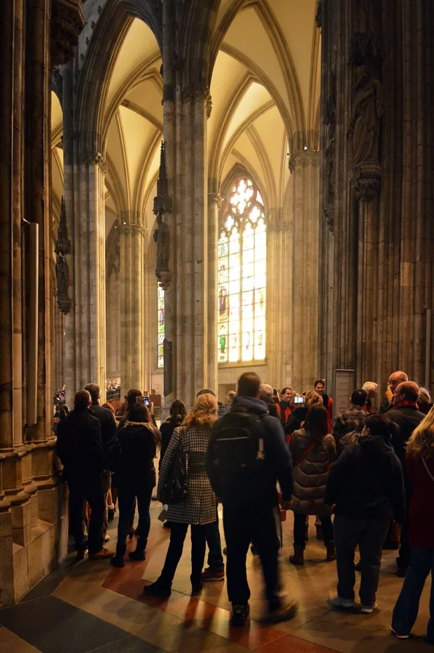 Cologne, Germany, Cologne Cathedral Stained Glass Back-lit tourists inside Cologne Cathedral, Cologne, 2014