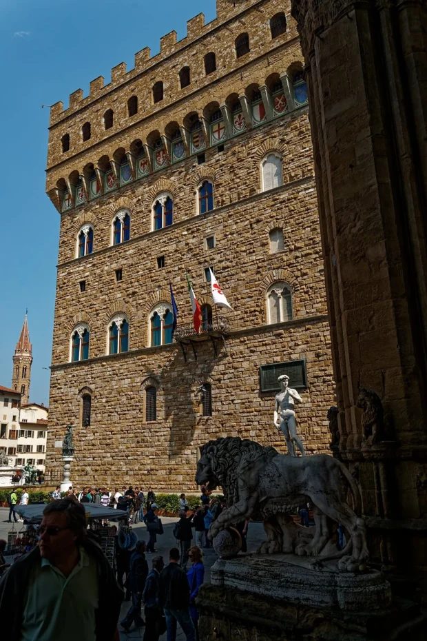 Florence, Italy, Palazzo Vecchio Statues Firenze - Florence - Loggia dei Lanzi - View East on Flaminio Vacca's Lion 1598, Michelangelo's David & Palazzo Vecchio