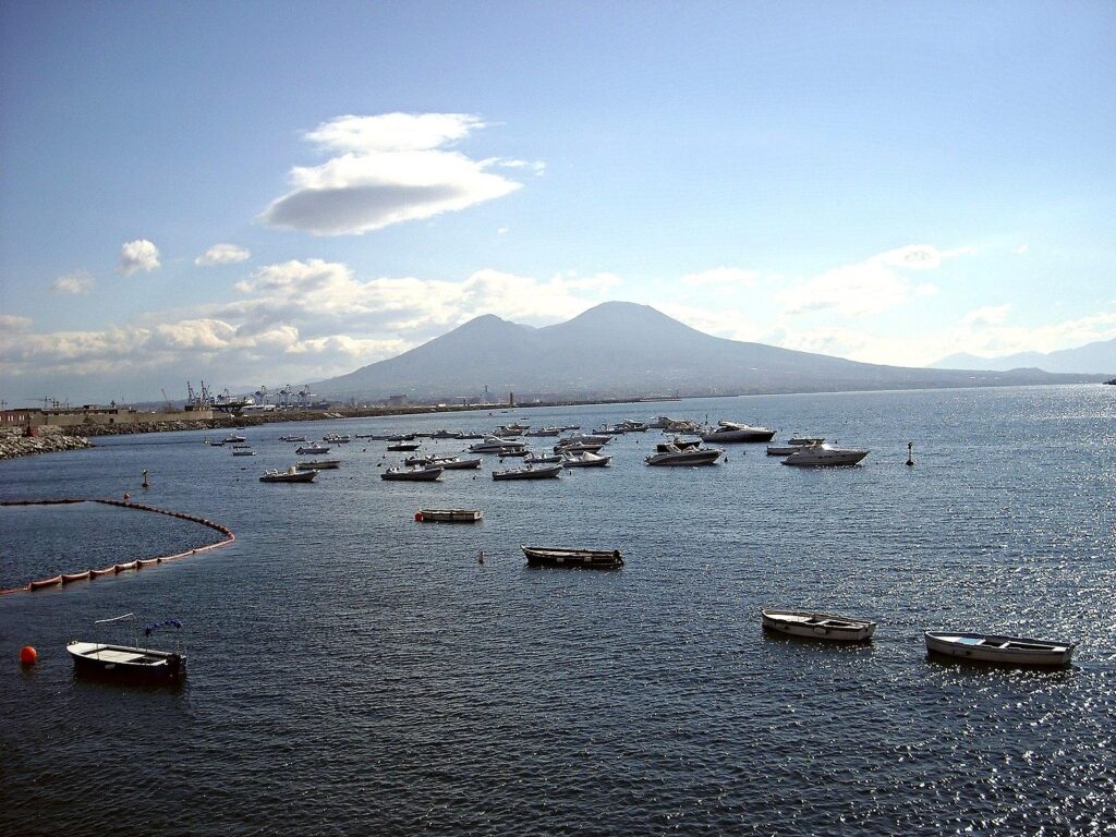 Boats and Vesuvius in Naples (29543890376)